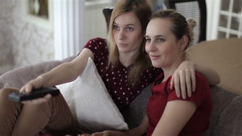 Two Friends Sisters Watching Tv Talking Stock Footage Sbv
