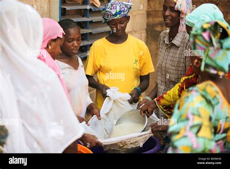 In Ouagadougou Burkina Faso Fulani Women Work Together To Make A