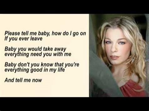 She is wearing a beige sweater with a red and white dress. LeAnn Rimes - How Do I Live Without You with Lyrics - YouTube