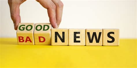 Good Or Bad News Hand Flips A Cube And Changes The Words `bad News` To