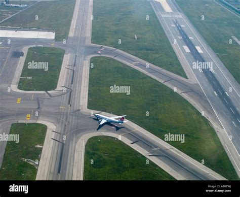 Aerial View Of Passenger Jet Taxiing On Runway Of Fiumicino Airport