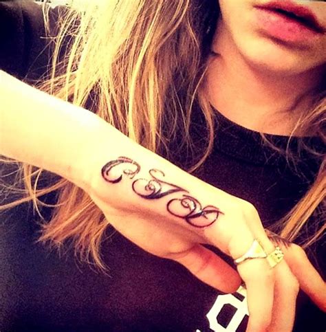 Cara Delevingnes Cjd Initials Tattoo On Her Hand Popstartats