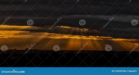 Rays Of Sunlight Through Heavy Dark Clouds Stock Photo Image Of