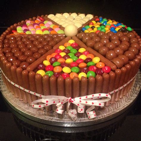 Chocolate Biscuit Cake Topped With Ganache And Sweets To Make A Fun
