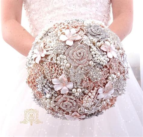 A Bridal Holding A Wedding Bouquet With Pearls And Flowers On Its Side