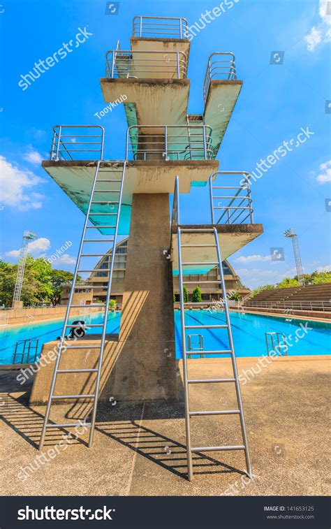 High Diving Board At A Public Swimming Pool Stock Photo 141653125
