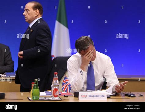 Italian Prime Minister Silvio Berlusconi Passes British Prime Minister