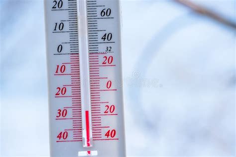 The Thermometer Lies On The Snow In Winter Showing A Negative