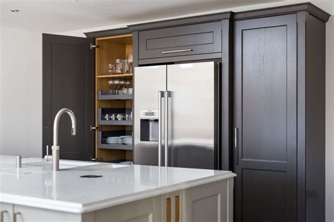 Grey is a true neutral that can look at home in modern kitchens just as well as traditional spaces, much like the versatile design of shaker cabinets themselves. A bespoke transitional style shaker kitchen in light and ...