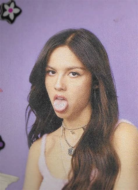 A Woman With Long Hair Sticking Out Her Tongue