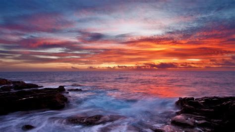 Download Wallpaper 1920x1080 Sea Sky Sunset Clouds Rocks Surf Full