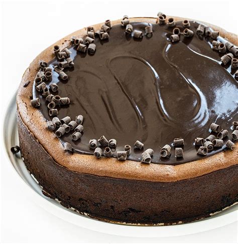 Triple Chocolate Cheesecake From Overhead Showing The Shiny Top And Chocolate Curls Double