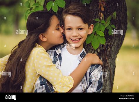 Little Girl Kissing Boy Stock Photo Alamy