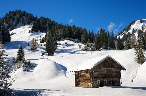Barn In Kleinwalsertal Austria Covered With Snow In Winter By Matthias