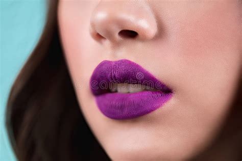Close Up Of The Woman`s Open Lips Purple Lipstick Lip Gloss