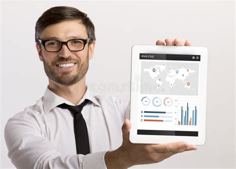 Happy Businessman Holding Digital Tablet With Financial App On Screen