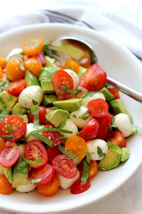 Avocado salad with tomato, cucumber and mozzarella served with some crunchy french bread and you've got a cool, easy dinner for a hot day. Tomato Mozzarella Avocado Salad - Green Valley Kitchen