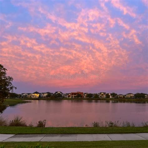 Beautiful Pink Orange And Blue Sunset Reflecting On A Lake In A