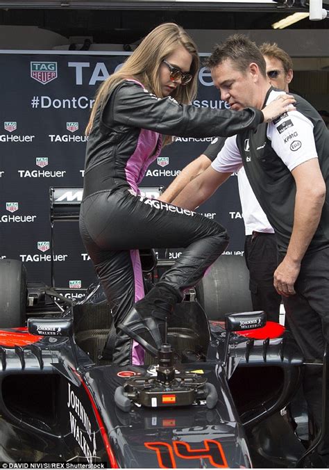 Cara Delevingne Gets Into The Grand Prix Spirit As She Dons Plunging