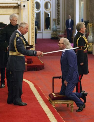 Bee Gees Frontman Barry Gibb Is Knighted At Buckingham Palace Photos