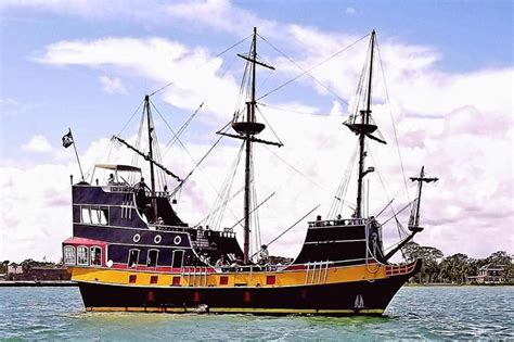 Pirate ship through rock arch,cyprus. The Pirate Ship Black Raven 2021 - St Augustine