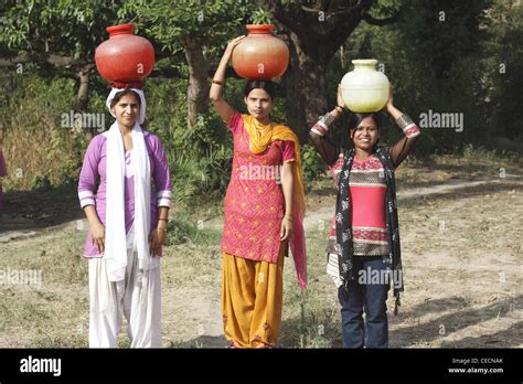 Indian Woman Carrying Water Pots To Fill From Well Villagers Have To Fetch Water From Its