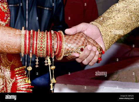 Bride And Groom Hands Together In Indian Wedding Stock Photo Alamy