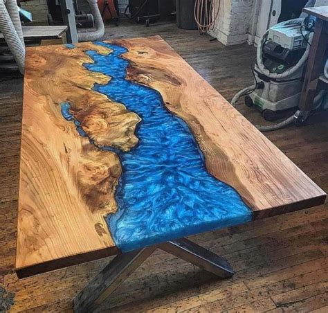 A Wooden Table With Blue Paint On It