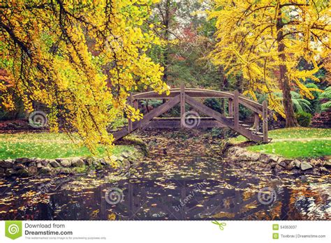 Picturesque Wooden Footbridge Over A Pond In Autumn Stock Image Image