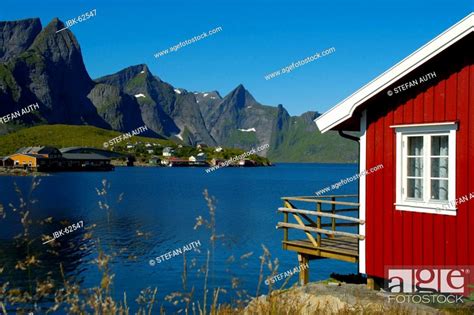 Red Wooden House Mountains And Fjord Hamnoya Moskenesoya Lofoten Norway