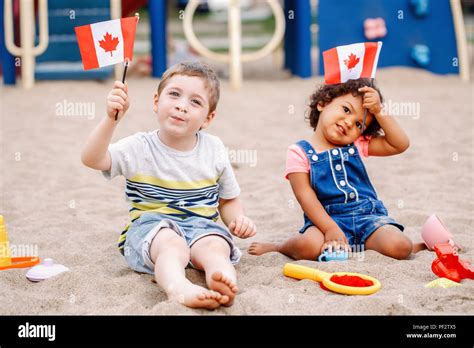 Portrait Of Adorable Cute Little Caucasian Boy And Latin Hispanic Baby