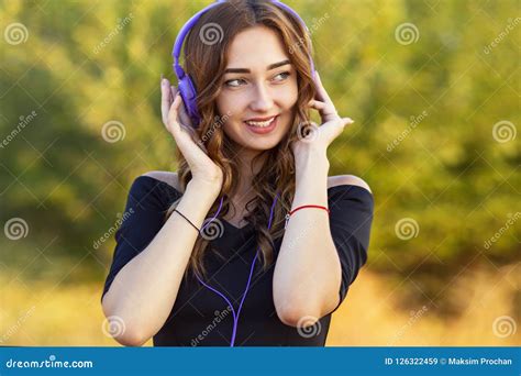 Portrait Of A Beautiful Girl With Headphones On Head Young Woman