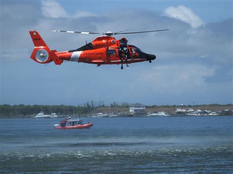 A Coast Guard Helicopter Demonstrates A Rescue Operation In The Cape May Canal Outside Of The