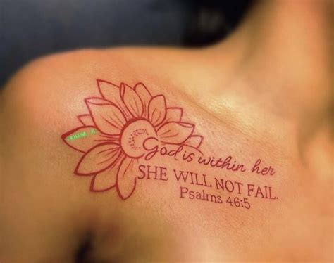 A Woman With A Tattoo On Her Shoulder That Says God Is Within Her She