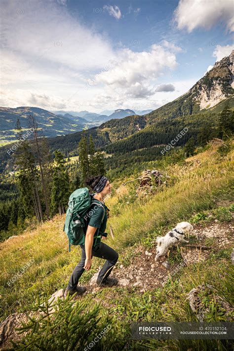 Woman With Dog Hiking At Wilder Kaiser Kaiser Mountains Tyrol