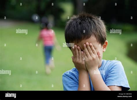 Kids Playing Hide And Seek Stock Photo Alamy
