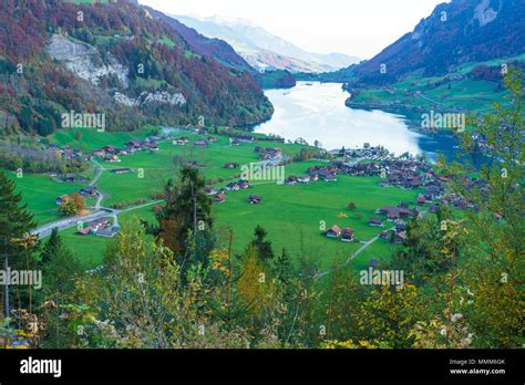Valley Of Lake Lungern Or Lungerersee With Traditional Alps Chalets In