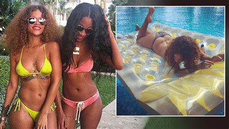 Rihanna Soaks Up The Sun In Barbados As Rumoured Love Interest Lewis