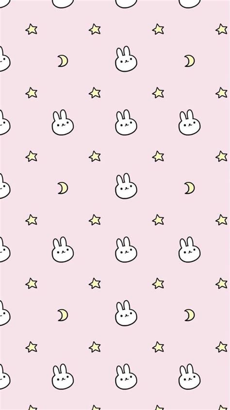 A Pink Wallpaper With Bunny Ears And Stars On The Bottom In Pastel Colors