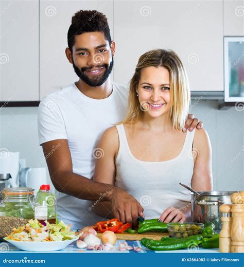 Interracial Couple Cooking Vegetables Stock Image Image Of Condiments