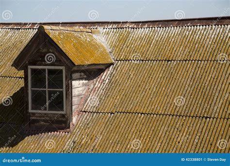 Old Corrugated Metal Roof With Moss And Rust Clear Sky Stock Image