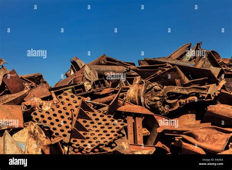 Scrap Metal Pile Against A Blue Sky Stock Photo Alamy