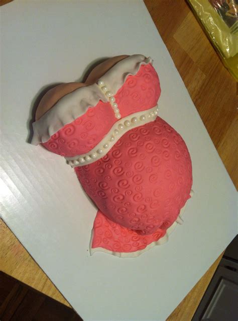 pink fondant pregnant belly cake i made with white ruffle and pearl embellishments the design