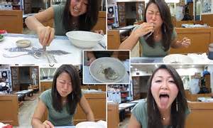Woman Eats A Live Octopus That Tries To Escape Across The Table On