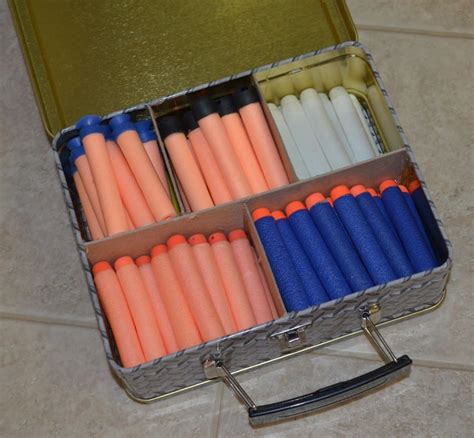 Youtube user topcitygear had experimented with a nerf blowgun before, but decided he wanted a bit more capability. Nerf storage ideas! - A girl and a glue gun