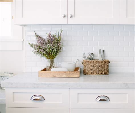 Subway tile is classic and beautiful, and it's not going out of style anytime soon. Inspiring White Kitchen with Light Blue Island - Home ...