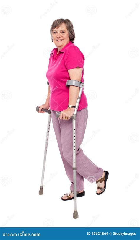 Smiling Senior Woman Walking With Crutches Stock Images Image 25621864