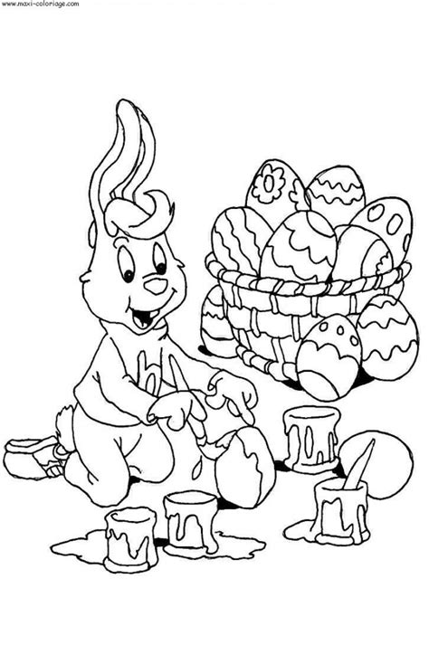 Colorie le lapin en ocre jaune le bout de son museau le dessous de ses pieds ses mains et linterieur. Coloriage Lapin peint L'oeuf de Pâques dessin gratuit à imprimer