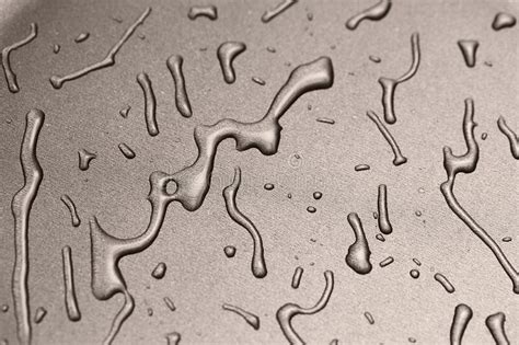 Metal Surface With Transparent Drops Close Up Texture With Spilled Transparent Liquid Stock