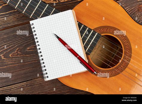 Blank Notebook And Pen On Guitar Stock Photo Alamy